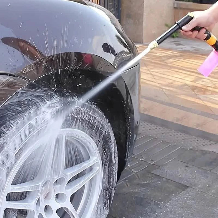 Complete car wash tool featuring high pressure water hose nozzle in action outdoors