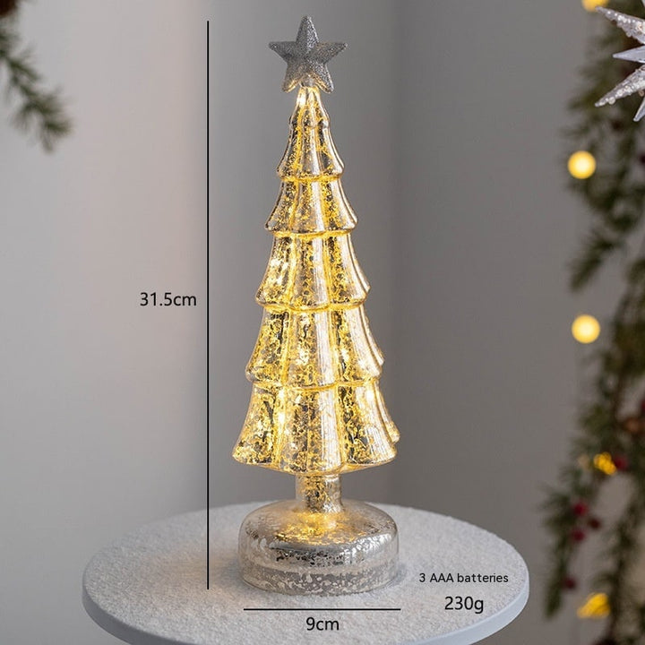 Detailed view of glowing LED lights inside a glass tabletop tree