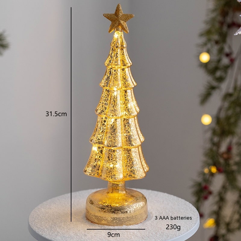 Illuminated glass-look holiday tree showcasing tabletop Christmas decor