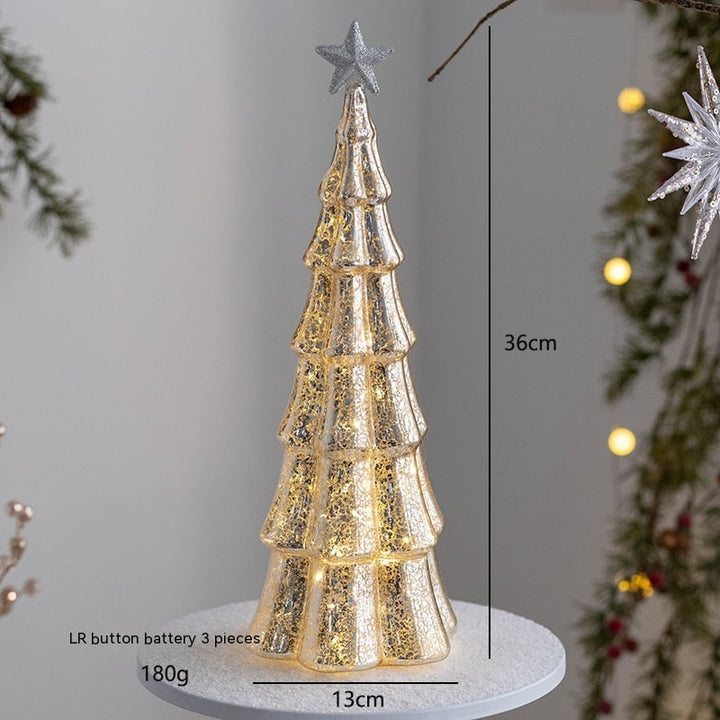Illuminated holiday accent piece shaped like a glass Christmas tree