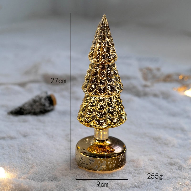 Close-up of frosted branches on an illuminated holiday table decor