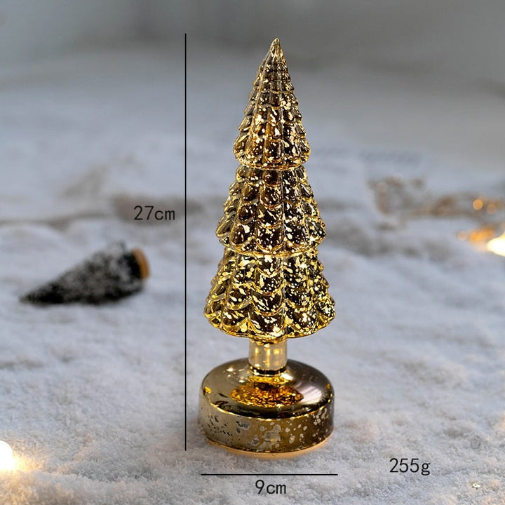 Close-up of frosted branches on an illuminated holiday table decor