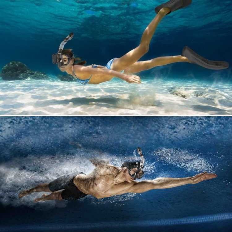 Man and woman swimming underwater wearing snorkel masks