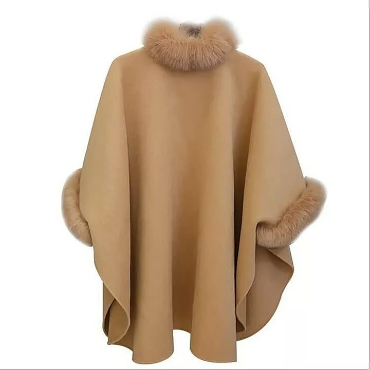 Grey winter cape coat for women showcasing a chic trimmed collar and cozy warm apparel styling.