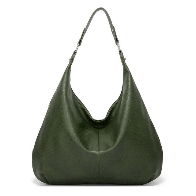 Interior lining fabric and stitched label detail inside the women's handbag