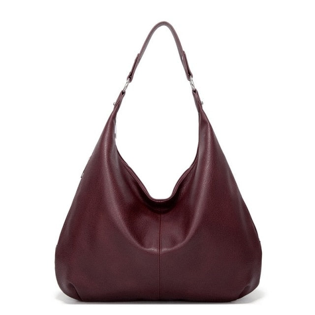 Collection of accessories including the luxury shoulder handbag and matching pouch