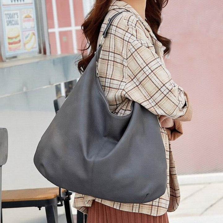 Crossbody strap attached to the women's handbag for versatile styling