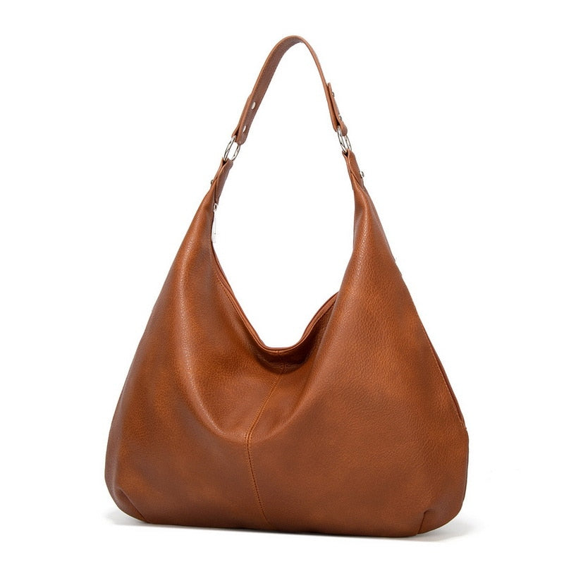 Brown women's luxury shoulder handbag displayed on a white background