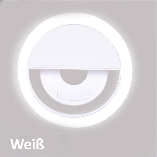 Compact USB rechargeable phone light held in hand, demonstrating its portable design
