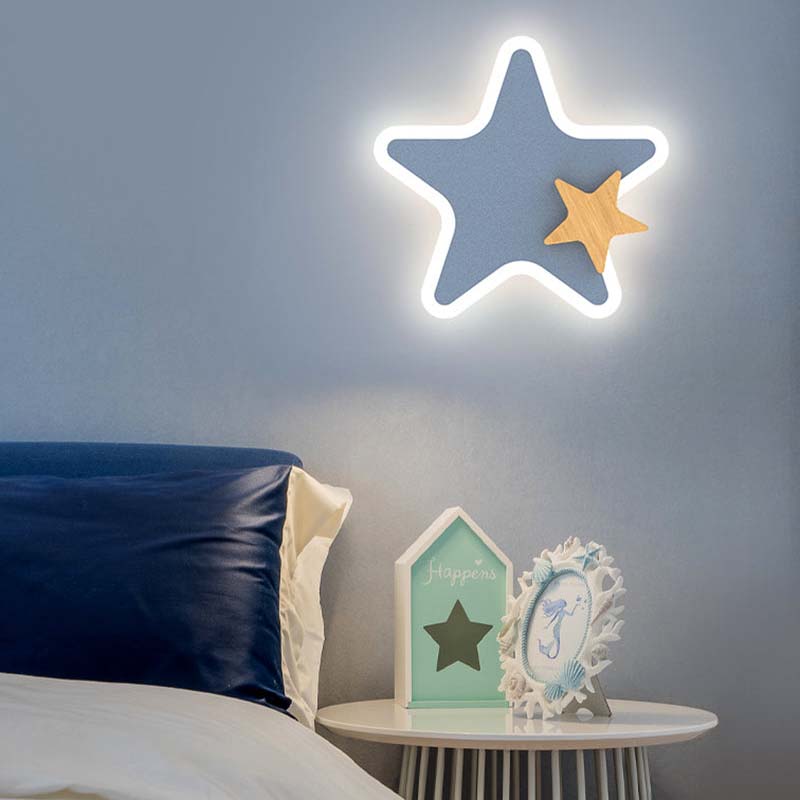 Close-up of the kids wall lamp showing the detailed moon and stars design