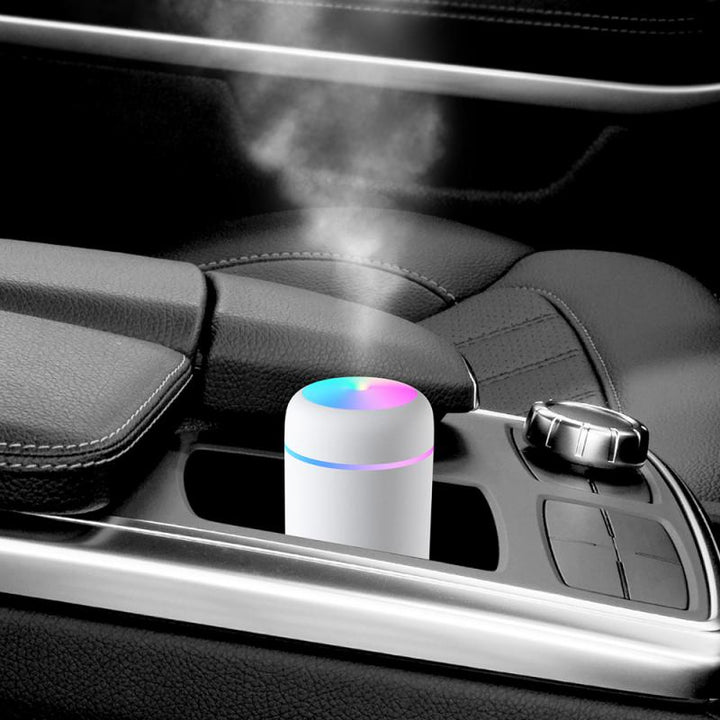 Mini H2O humidifier placed in a car center console cup holder