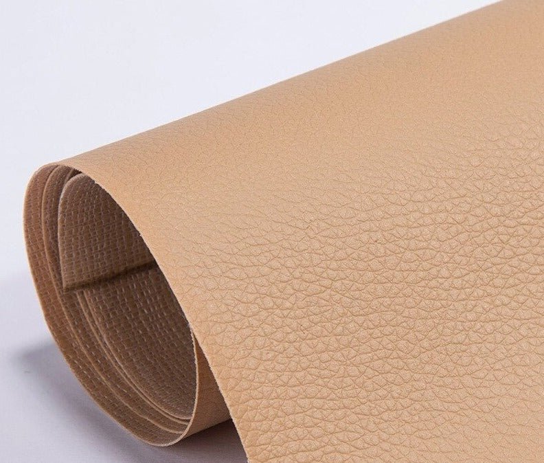 Applying a large PU leather patch to restore a damaged sofa