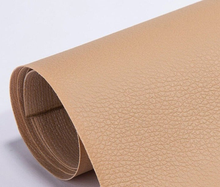 Applying a large PU leather patch to restore a damaged sofa