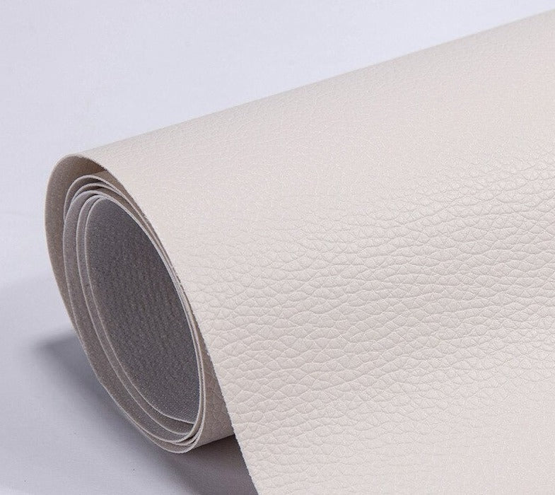Peeling backing paper off self-adhesive upholstery repair patch