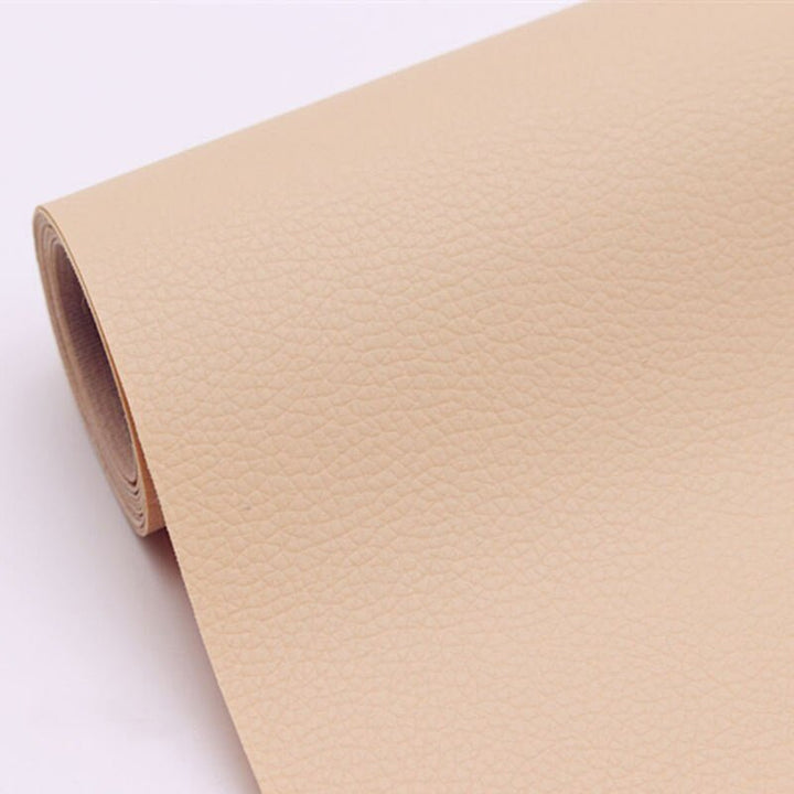 Scratch protector leather patch applied to office chair armrest