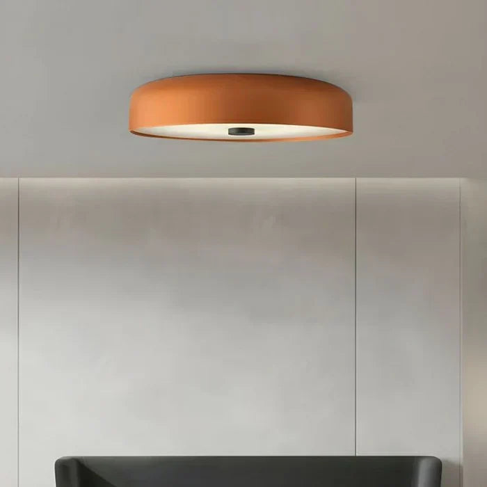 Sleek geometric silhouette of the modern minimalist ceiling light against a neutral ceiling.