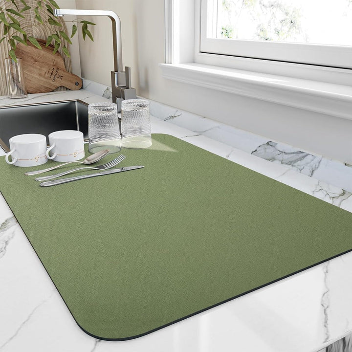 Grey dish drying mat protecting kitchen countertops from water