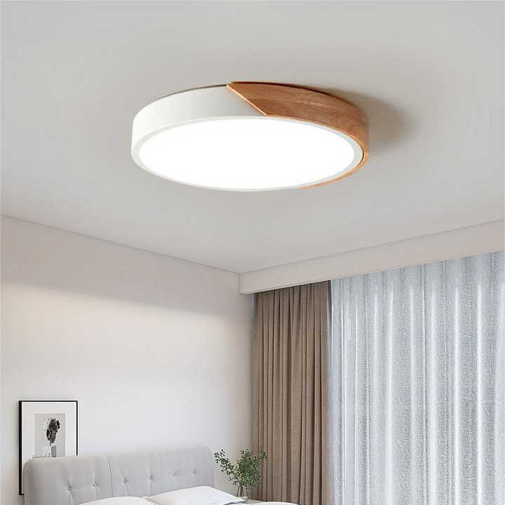 White Nordic Macaron round wooden ceiling lamp installed in a cozy minimalist bedroom