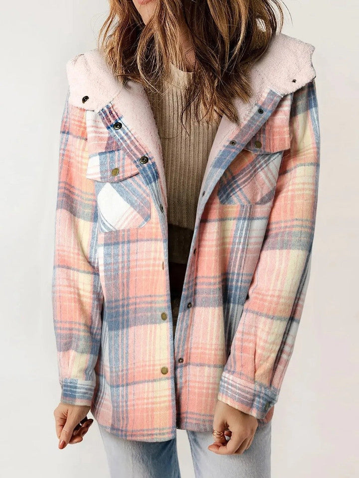 Side profile of a woman wearing the stylish plaid hooded outerwear piece