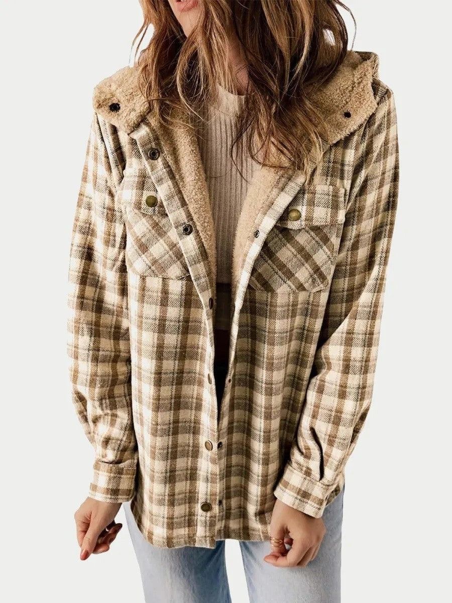 Woman wearing a khaki hooded plaid jacket with soft plush trim and buttons