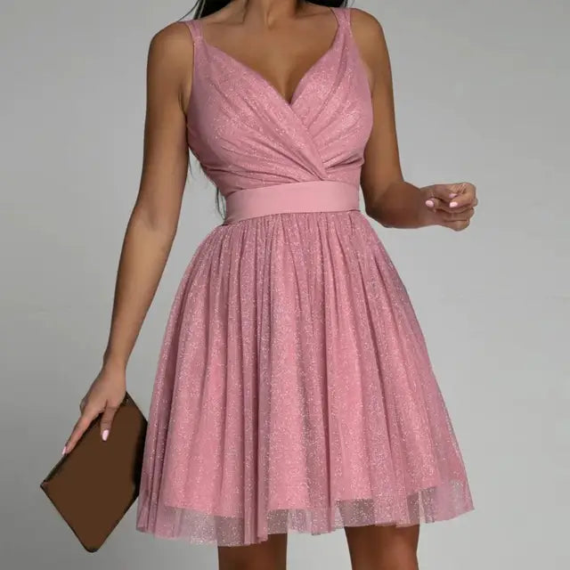 Woman wearing pink radiant sparkle party dress with sleeveless design