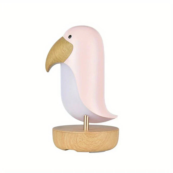 Pink rechargeable bird nightlight shaped like a woodpecker on a wood base