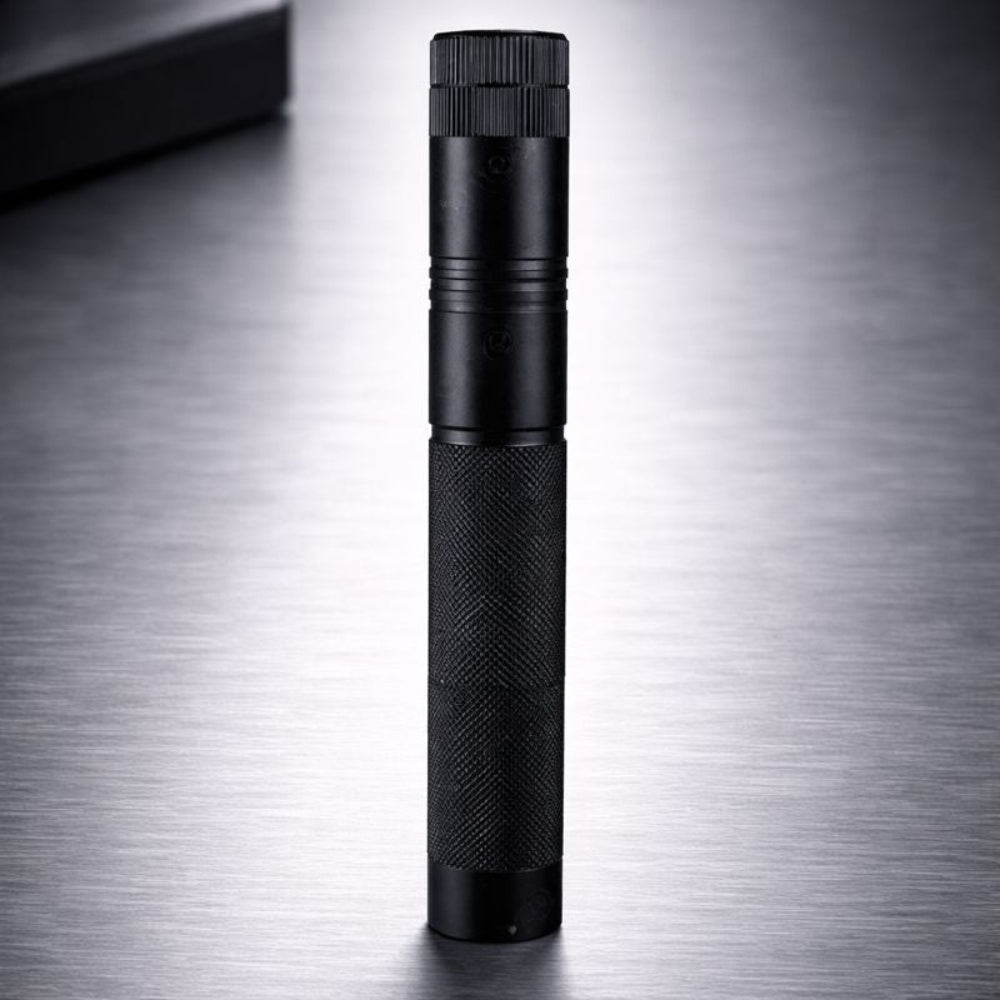 Compact handheld black laser pointer tool viewed vertically