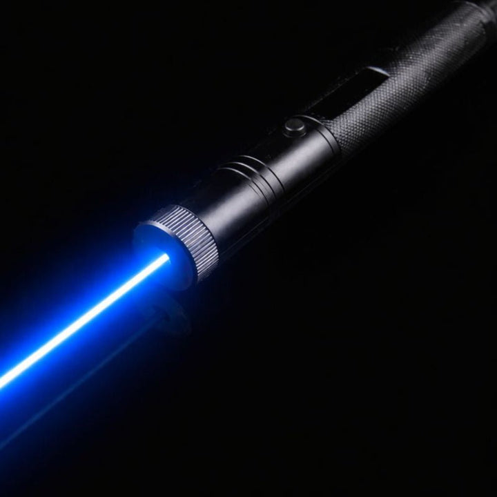 Presentation tool laser pointer being held by a speaker during a business meeting.