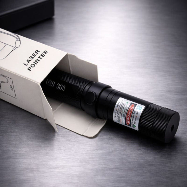 Black USB rechargeable laser pointer next to its retail box