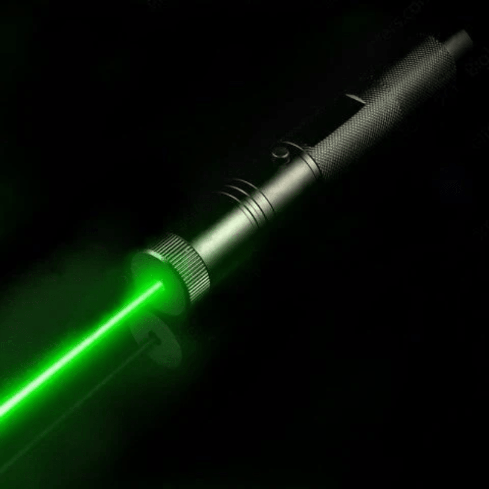 Rechargeable laser pointer projecting a bright green beam in the dark