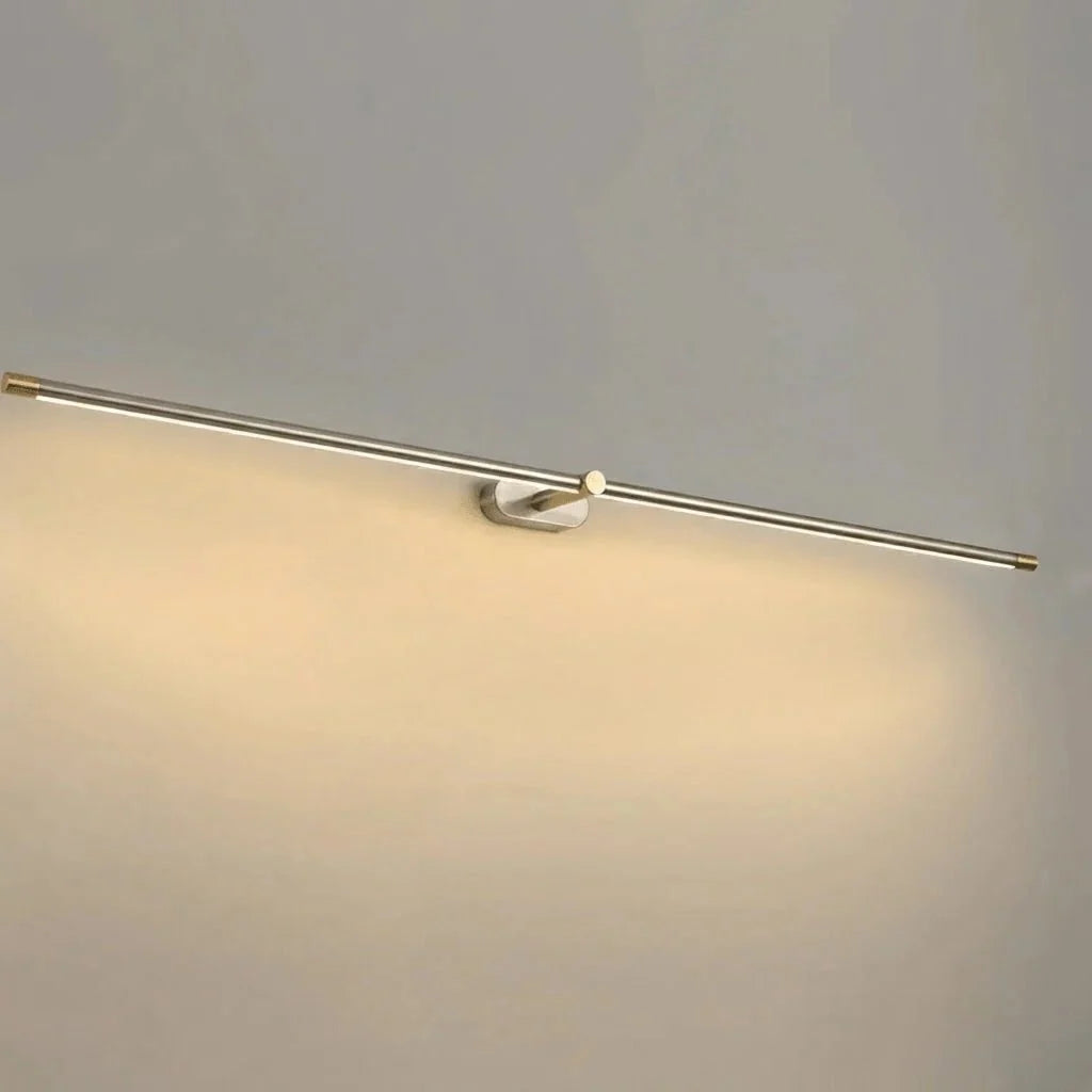 Nickel and gold cordless wall lamp providing soft accent illumination