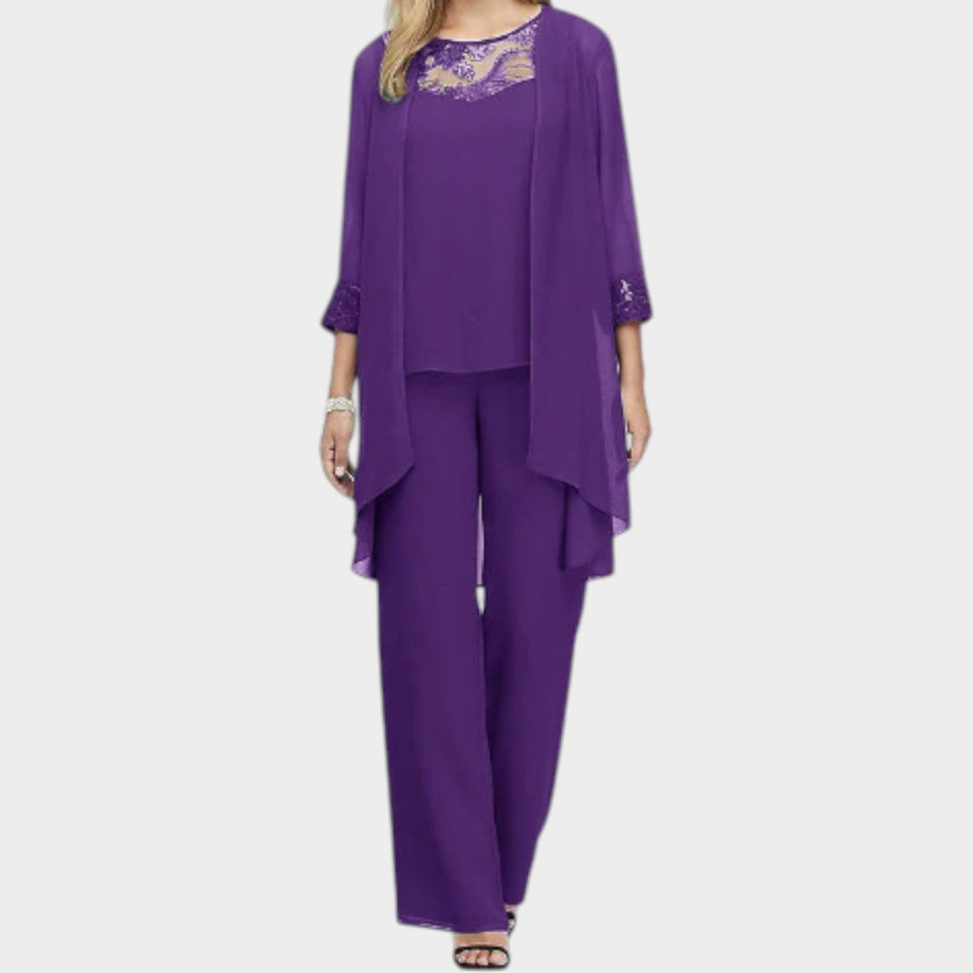 Chic women's wedding guest outfit featuring a layered chiffon top and matching trousers
