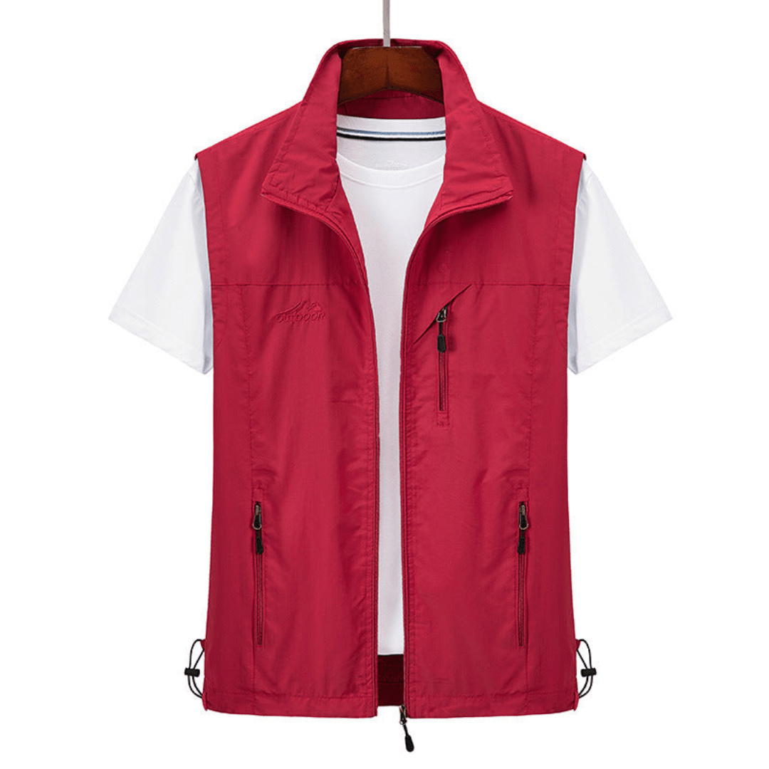 Red full-zip outdoor vest hanging on a wooden hanger