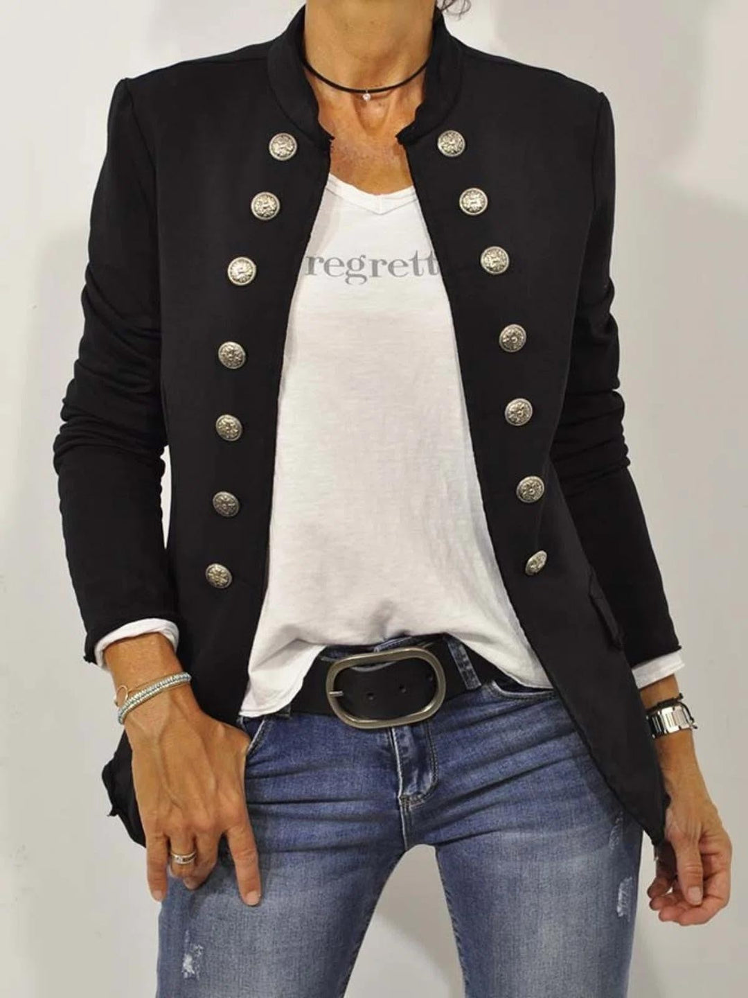 Woman wearing black military-style button front blouse with stand collar