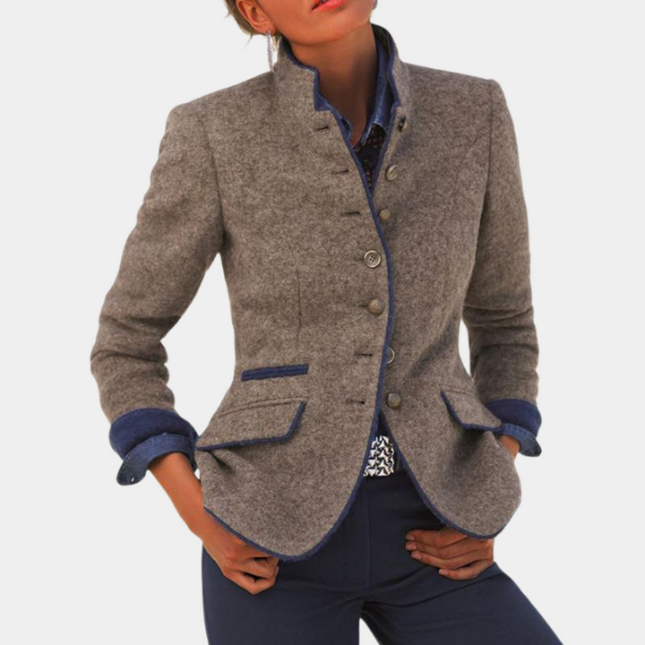 Model wearing brown structured women's blazer with professional styling