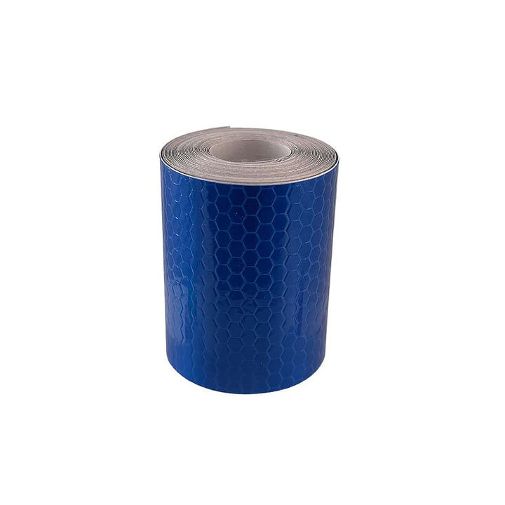 Blue reflective tape roll standing upright against a white background