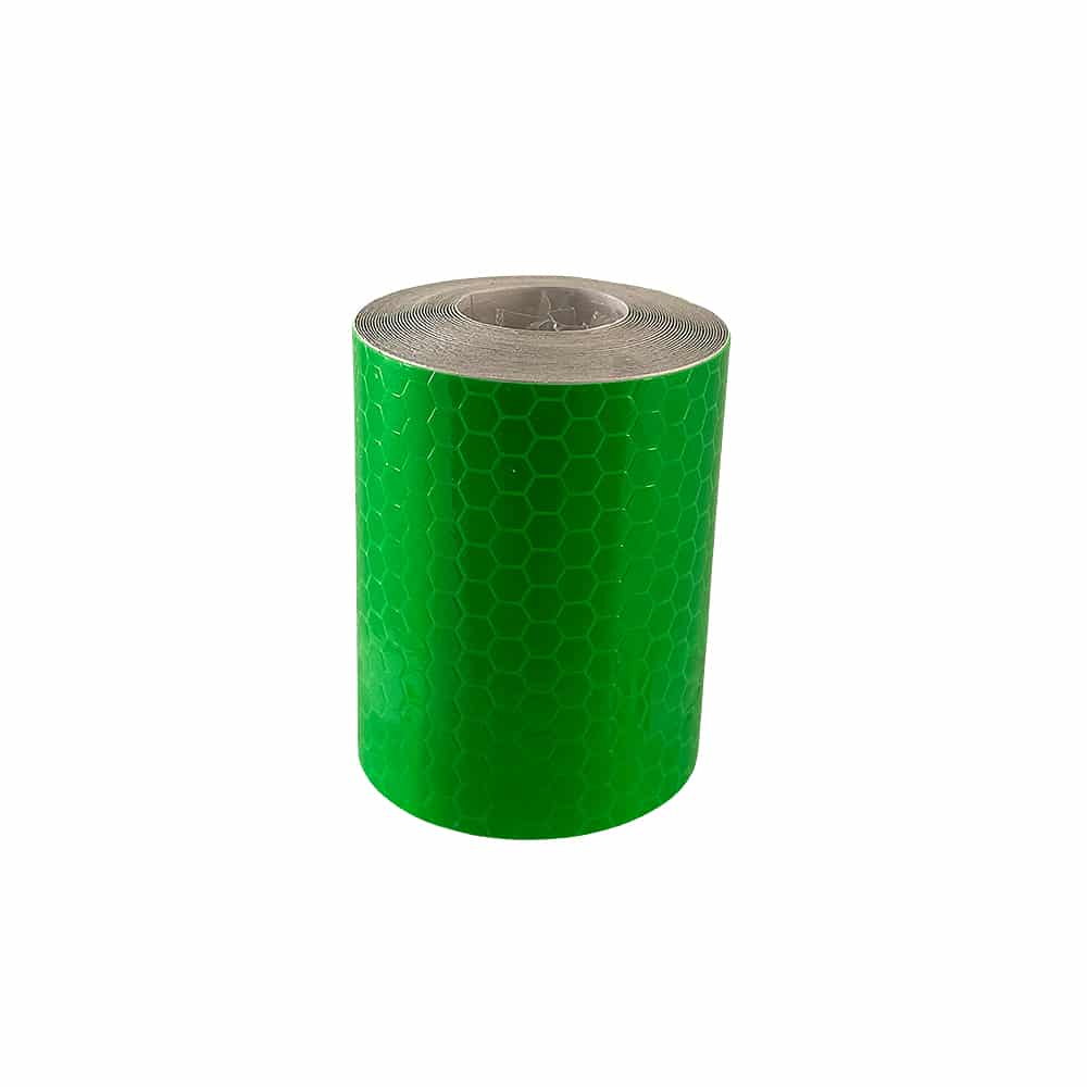 Green reflective tape roll standing upright against a white background