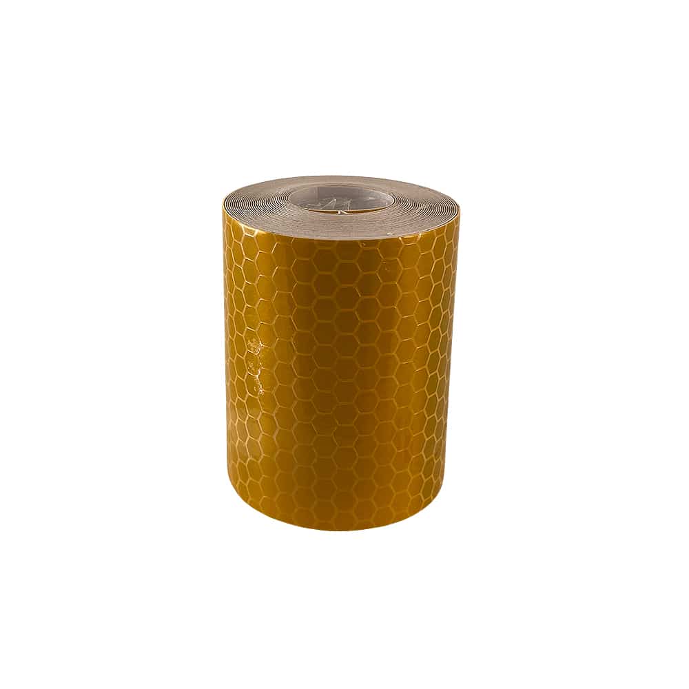 Yellow reflective tape roll standing upright against a white background
