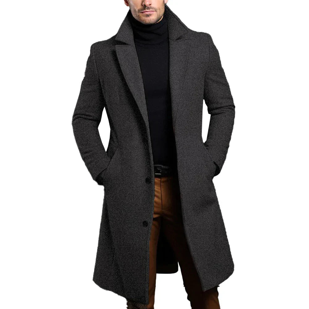 Man wearing a dark grey long overcoat with a sophisticated collar