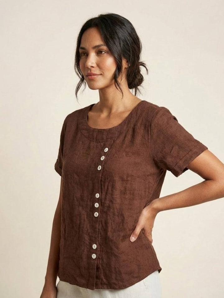 Detailed stitch work on women's short sleeve scoop neck top