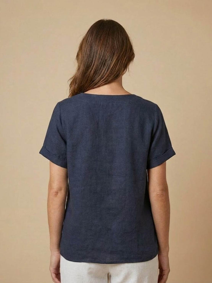 Close-up of hemline on women's relaxed fit casual top