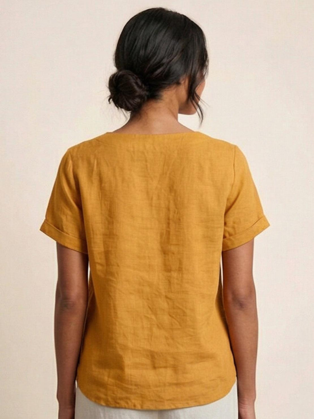 Close shot of sleeve cuff on women's casual fashion tee