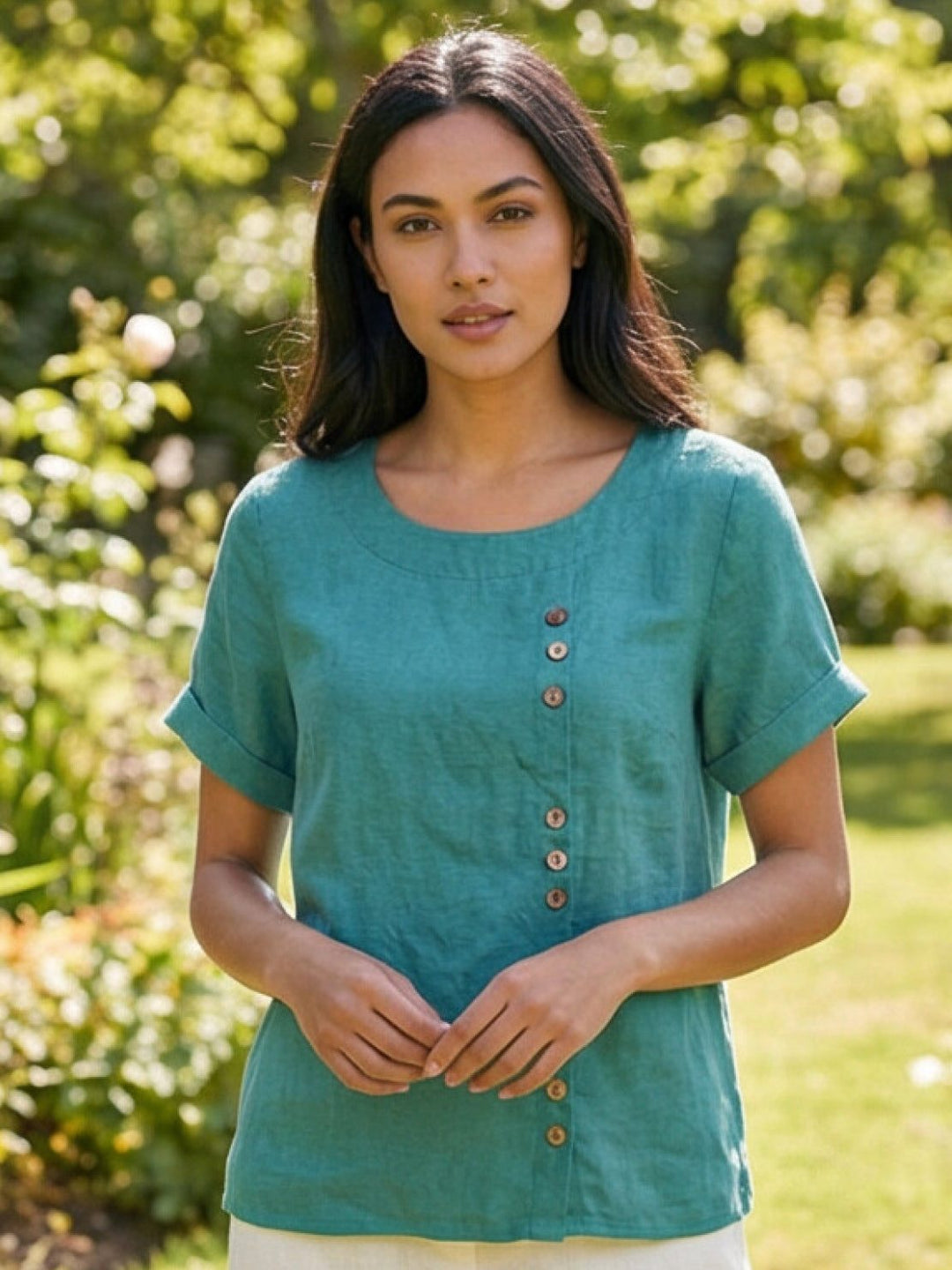 Close-up of decorative buttons on women's summer tee