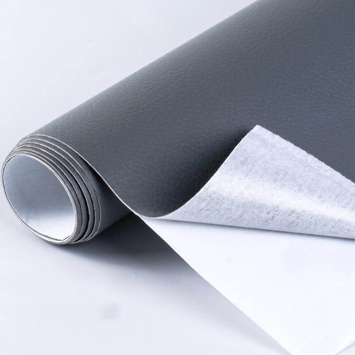 Strong adhesive backing on a brown leather repair patch sheet