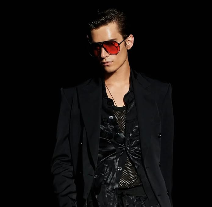 Man wearing red-tinted retro aviator sunglasses with a black jacket