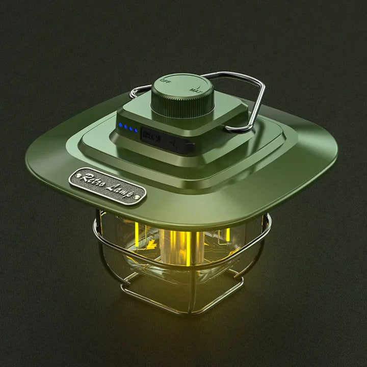Green retro LED camping lantern sitting on a dark surface