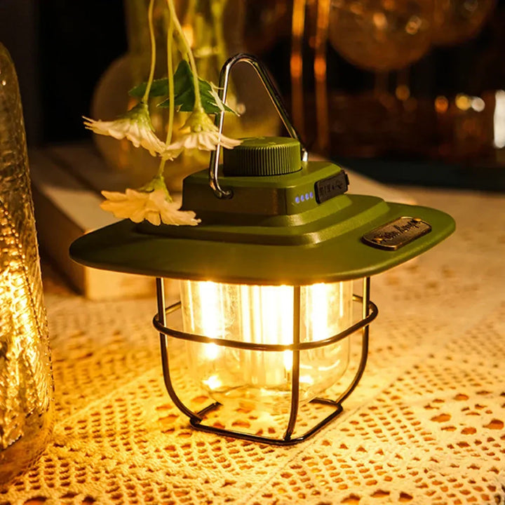 Retro rechargeable LED camping lantern hanging outdoors