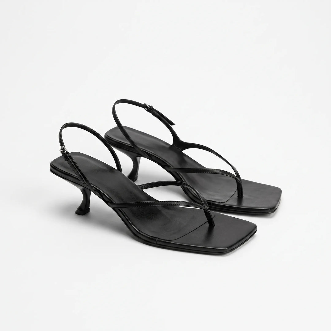 Black elegant kitten heel sandals featuring thong construction