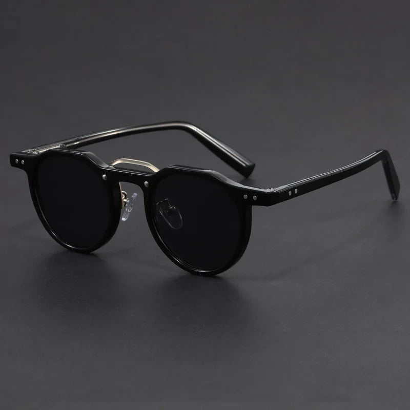 Trendy retro sunglasses resting on a flat surface, ideal for sunny days