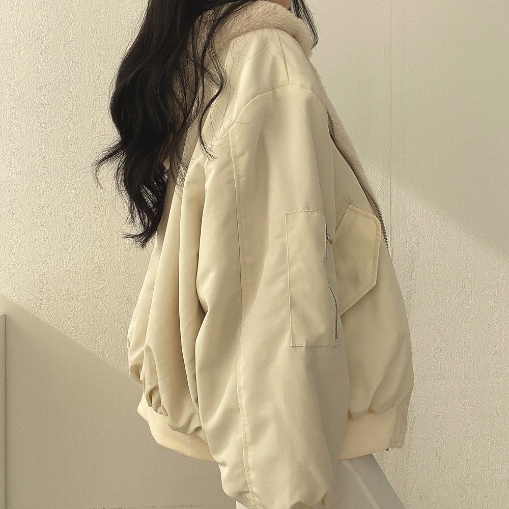 Close-up of durable fabric and stitching on blue winter jacket